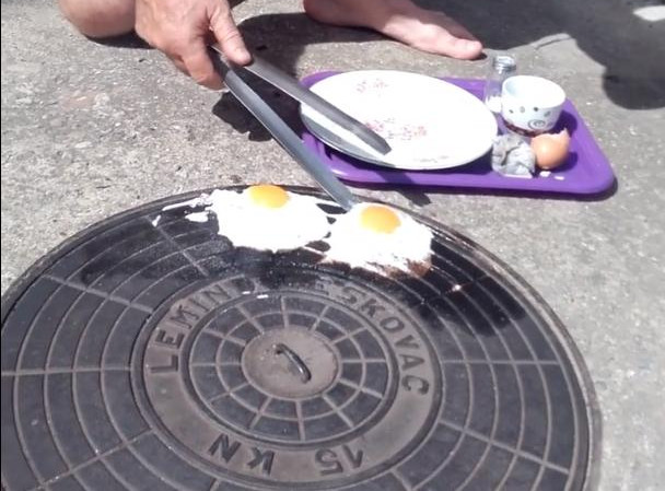 (VIDEO) KAD UPEČE ZVEZDA: Leskovčanin na poklopcu šahta ispržio jaja!