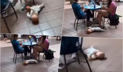 /VIDEO/ ŠOKANTAN SNIMAK IZ TRŽNOG CENTRA! Roditelji jedu za stolom, dok njihova beba leži na podu!