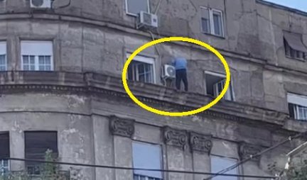 ŠOK SCENA NA DORĆOLU! Muškarac izašao na vrh zgrade, DRŽI SE SAMO ZA... (VIDEO)
