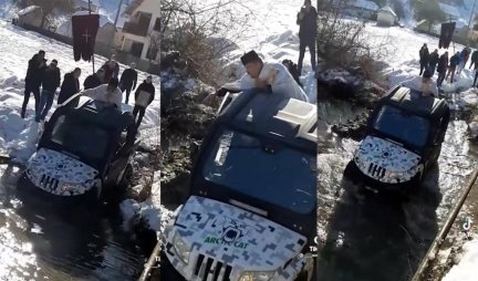 HAJDE, JE L IMATE M*DA?! Pop uleteo džipom u reku, pa hrabrio plivače da uđu u LEDENU VODU! (VIDEO)