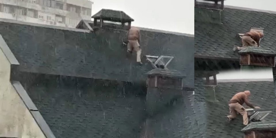 (VIDEO) Prizor od kog se ledi krv u žilama! Kiša pljušti, a čovek šeta po krovu